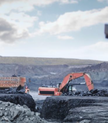 Miners in discussion in surface coal mine